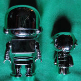 RYAN'S WORLD - PAREJA FIGURAS COLOR PLATEADO METÁLICO -