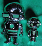 RYAN'S WORLD - PAREJA FIGURAS COLOR PLATEADO METÁLICO -